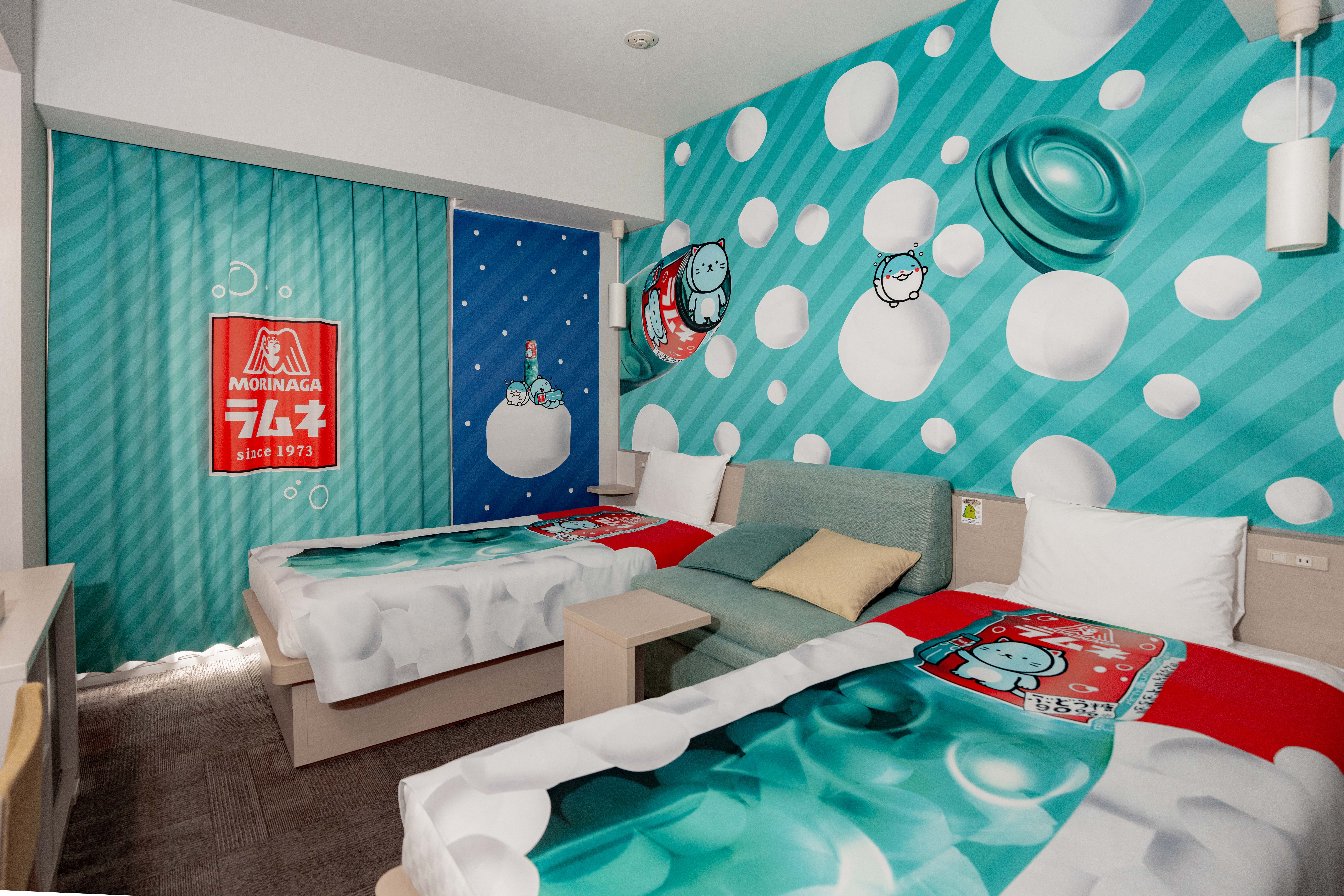 Henn na Hotel "Collaboration Room with the Most in the World" Guinness World Records™ Certified 53rd Collaboration Room World First! An experiential guest room where you can be surrounded by, see, eat, and play with 'Morinaga Ramune' Henn na Hotel & Henn na Resort & Spa "Morinaga Ramune Room" Released
